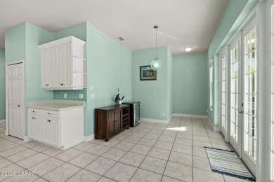 Welcome to this beautifully maintained 4-bedroom, 2-bathroom on Plantation Bay Golf and Country Club in Florida - for sale on GolfHomes.com, golf home, golf lot