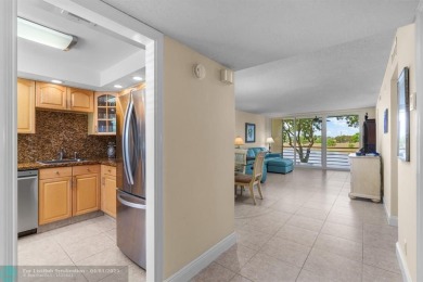 Enjoy a Serene Lake View from this Super Clean, Bright 2nd Floor on Palm-Aire Country Club and Resort - Palms in Florida - for sale on GolfHomes.com, golf home, golf lot