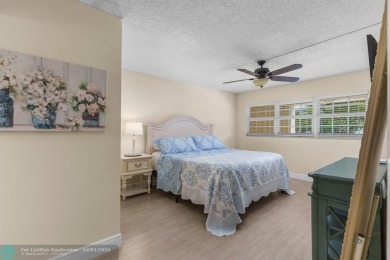 Enjoy a Serene Lake View from this Super Clean, Bright 2nd Floor on Palm-Aire Country Club and Resort - Palms in Florida - for sale on GolfHomes.com, golf home, golf lot