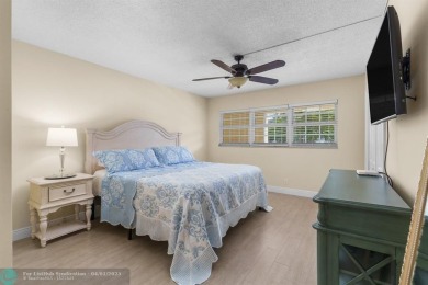 Enjoy a Serene Lake View from this Super Clean, Bright 2nd Floor on Palm-Aire Country Club and Resort - Palms in Florida - for sale on GolfHomes.com, golf home, golf lot