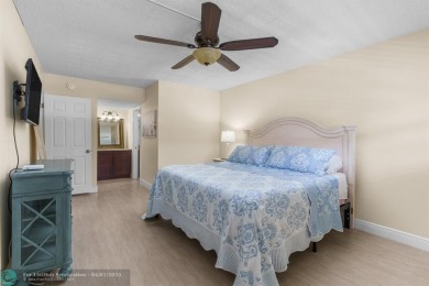Enjoy a Serene Lake View from this Super Clean, Bright 2nd Floor on Palm-Aire Country Club and Resort - Palms in Florida - for sale on GolfHomes.com, golf home, golf lot