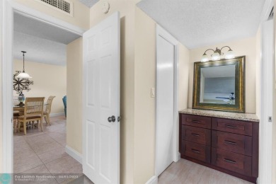 Enjoy a Serene Lake View from this Super Clean, Bright 2nd Floor on Palm-Aire Country Club and Resort - Palms in Florida - for sale on GolfHomes.com, golf home, golf lot