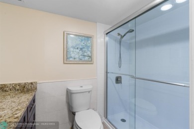 Enjoy a Serene Lake View from this Super Clean, Bright 2nd Floor on Palm-Aire Country Club and Resort - Palms in Florida - for sale on GolfHomes.com, golf home, golf lot