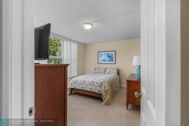 Enjoy a Serene Lake View from this Super Clean, Bright 2nd Floor on Palm-Aire Country Club and Resort - Palms in Florida - for sale on GolfHomes.com, golf home, golf lot