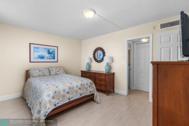 Enjoy a Serene Lake View from this Super Clean, Bright 2nd Floor on Palm-Aire Country Club and Resort - Palms in Florida - for sale on GolfHomes.com, golf home, golf lot