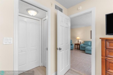 Enjoy a Serene Lake View from this Super Clean, Bright 2nd Floor on Palm-Aire Country Club and Resort - Palms in Florida - for sale on GolfHomes.com, golf home, golf lot