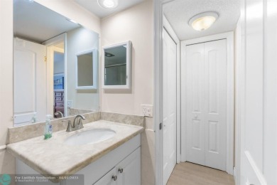 Enjoy a Serene Lake View from this Super Clean, Bright 2nd Floor on Palm-Aire Country Club and Resort - Palms in Florida - for sale on GolfHomes.com, golf home, golf lot