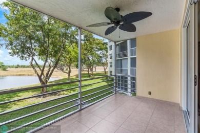 Enjoy a Serene Lake View from this Super Clean, Bright 2nd Floor on Palm-Aire Country Club and Resort - Palms in Florida - for sale on GolfHomes.com, golf home, golf lot