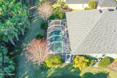 Welcome to this beautifully maintained 4-bedroom, 2-bathroom on Plantation Bay Golf and Country Club in Florida - for sale on GolfHomes.com, golf home, golf lot