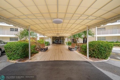 Enjoy a Serene Lake View from this Super Clean, Bright 2nd Floor on Palm-Aire Country Club and Resort - Palms in Florida - for sale on GolfHomes.com, golf home, golf lot