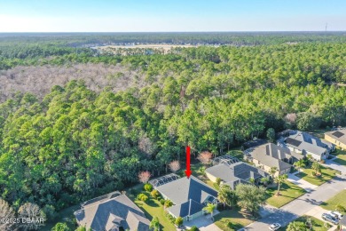 Welcome to this beautifully maintained 4-bedroom, 2-bathroom on Plantation Bay Golf and Country Club in Florida - for sale on GolfHomes.com, golf home, golf lot