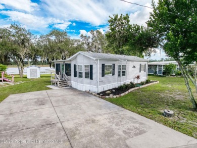 NO LOT RENT, it is a deeded lot, 2 bedrooms 1 Bath. A/C 2018 and on Glen Lakes Country Club in Florida - for sale on GolfHomes.com, golf home, golf lot