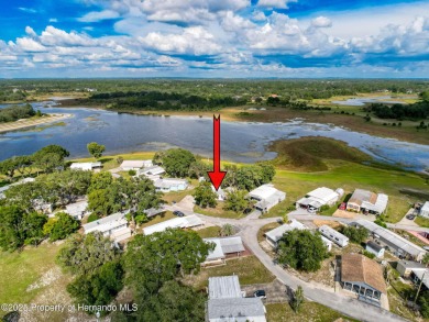 NO LOT RENT, it is a deeded lot, 2 bedrooms 1 Bath. A/C 2018 and on Glen Lakes Country Club in Florida - for sale on GolfHomes.com, golf home, golf lot