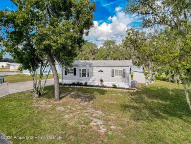 NO LOT RENT, it is a deeded lot, 2 bedrooms 1 Bath. A/C 2018 and on Glen Lakes Country Club in Florida - for sale on GolfHomes.com, golf home, golf lot