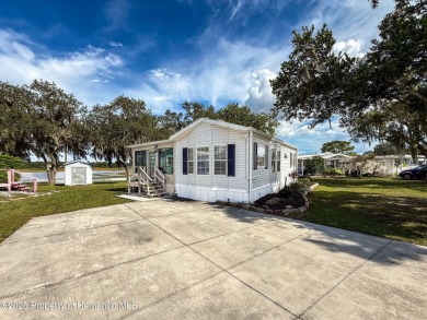 NO LOT RENT, it is a deeded lot, 2 bedrooms 1 Bath. A/C 2018 and on Glen Lakes Country Club in Florida - for sale on GolfHomes.com, golf home, golf lot
