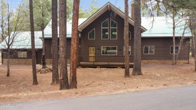 Experience comfort and privacy in this 5-bedroom, 6-bathroom on Pinetop Lakes Country Club in Arizona - for sale on GolfHomes.com, golf home, golf lot