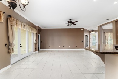 Welcome to this beautiful 3-bedroom, 2-bath lakefront home on Grasslands Golf and Country Club in Florida - for sale on GolfHomes.com, golf home, golf lot