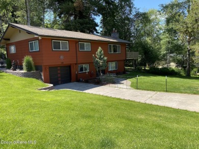 Nestled in a park-like setting just minutes from Pinehurst Golf on Pinehurst Golf Course in Idaho - for sale on GolfHomes.com, golf home, golf lot