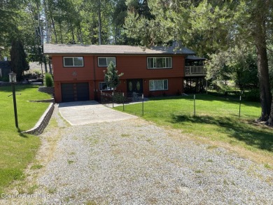 Nestled in a park-like setting just minutes from Pinehurst Golf on Pinehurst Golf Course in Idaho - for sale on GolfHomes.com, golf home, golf lot