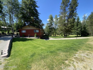 Nestled in a park-like setting just minutes from Pinehurst Golf on Pinehurst Golf Course in Idaho - for sale on GolfHomes.com, golf home, golf lot