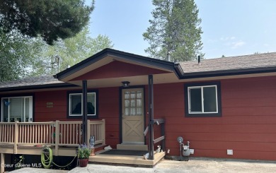 Nestled in a park-like setting just minutes from Pinehurst Golf on Pinehurst Golf Course in Idaho - for sale on GolfHomes.com, golf home, golf lot