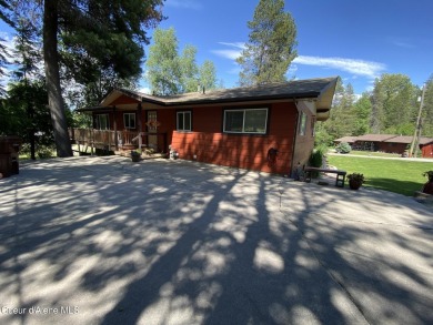 Nestled in a park-like setting just minutes from Pinehurst Golf on Pinehurst Golf Course in Idaho - for sale on GolfHomes.com, golf home, golf lot