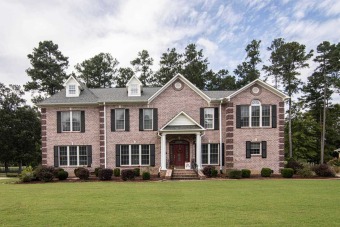 Two story majestic brick home on golf course at Stone Bridge on Stonebridge Golf Club in Georgia - for sale on GolfHomes.com, golf home, golf lot