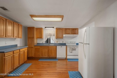 Step into this beautifully maintained 4-bedroom, 2-bathroom home on High Point Golf Club, Inc. in Florida - for sale on GolfHomes.com, golf home, golf lot