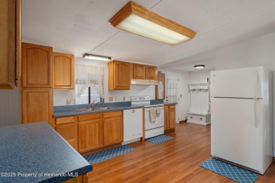 Step into this beautifully maintained 4-bedroom, 2-bathroom home on High Point Golf Club, Inc. in Florida - for sale on GolfHomes.com, golf home, golf lot