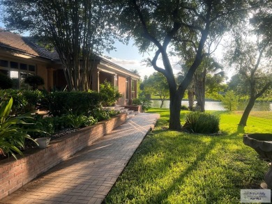 This stunning custom-built home is situated on an oversized on Rancho Viejo Resort and Country Club in Texas - for sale on GolfHomes.com, golf home, golf lot