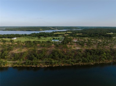With scenic views of the sky and water, Lot 9 of the Carter on Twisted Oaks Golf Club in Texas - for sale on GolfHomes.com, golf home, golf lot