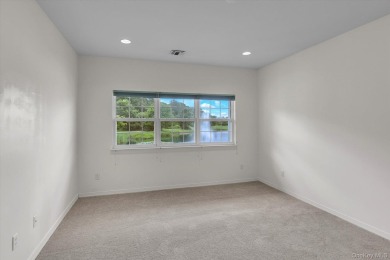 This 2 bedroom end unit ranch home is in a prime location on The Woods At Cherry Creek in New York - for sale on GolfHomes.com, golf home, golf lot