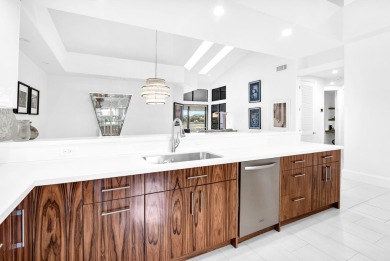 Stunning lake views are the showstopping feature of this on Boca Delray Golf and Country Club in Florida - for sale on GolfHomes.com, golf home, golf lot