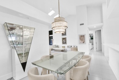 Stunning lake views are the showstopping feature of this on Boca Delray Golf and Country Club in Florida - for sale on GolfHomes.com, golf home, golf lot