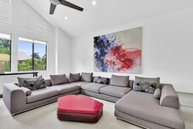 Stunning lake views are the showstopping feature of this on Boca Delray Golf and Country Club in Florida - for sale on GolfHomes.com, golf home, golf lot