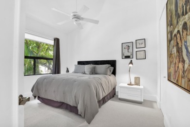 Stunning lake views are the showstopping feature of this on Boca Delray Golf and Country Club in Florida - for sale on GolfHomes.com, golf home, golf lot