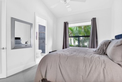 Stunning lake views are the showstopping feature of this on Boca Delray Golf and Country Club in Florida - for sale on GolfHomes.com, golf home, golf lot
