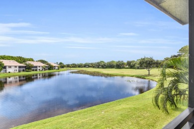 Stunning lake views are the showstopping feature of this on Boca Delray Golf and Country Club in Florida - for sale on GolfHomes.com, golf home, golf lot