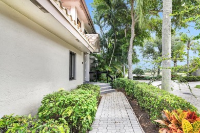 Stunning lake views are the showstopping feature of this on Boca Delray Golf and Country Club in Florida - for sale on GolfHomes.com, golf home, golf lot