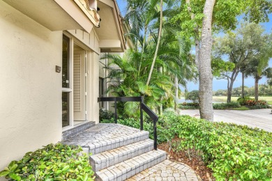 Stunning lake views are the showstopping feature of this on Boca Delray Golf and Country Club in Florida - for sale on GolfHomes.com, golf home, golf lot