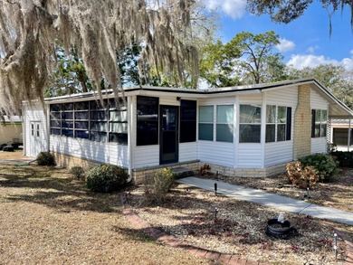 This home just listed and has 2 sheds! One has a separate on Water Oak Country Club Estates in Florida - for sale on GolfHomes.com, golf home, golf lot