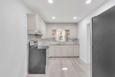 This charming 3-bedroom, 2-bath, 4-sided brick ranch in on Browns Mill Golf Course in Georgia - for sale on GolfHomes.com, golf home, golf lot