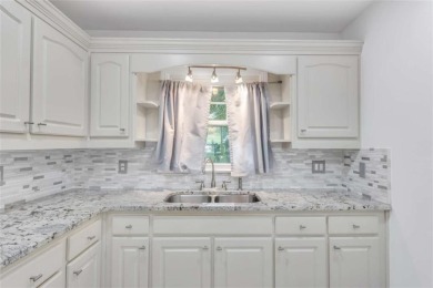 This charming 3-bedroom, 2-bath, 4-sided brick ranch in on Browns Mill Golf Course in Georgia - for sale on GolfHomes.com, golf home, golf lot