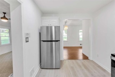 This charming 3-bedroom, 2-bath, 4-sided brick ranch in on Browns Mill Golf Course in Georgia - for sale on GolfHomes.com, golf home, golf lot