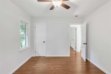 This charming 3-bedroom, 2-bath, 4-sided brick ranch in on Browns Mill Golf Course in Georgia - for sale on GolfHomes.com, golf home, golf lot