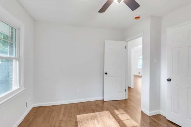 This charming 3-bedroom, 2-bath, 4-sided brick ranch in on Browns Mill Golf Course in Georgia - for sale on GolfHomes.com, golf home, golf lot