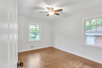 This charming 3-bedroom, 2-bath, 4-sided brick ranch in on Browns Mill Golf Course in Georgia - for sale on GolfHomes.com, golf home, golf lot