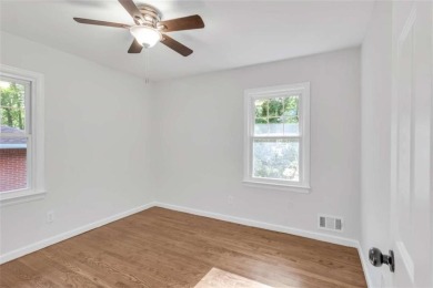 This charming 3-bedroom, 2-bath, 4-sided brick ranch in on Browns Mill Golf Course in Georgia - for sale on GolfHomes.com, golf home, golf lot