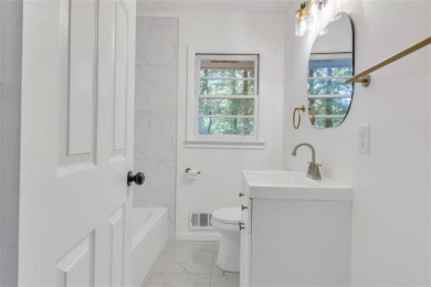 This charming 3-bedroom, 2-bath, 4-sided brick ranch in on Browns Mill Golf Course in Georgia - for sale on GolfHomes.com, golf home, golf lot