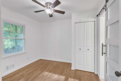 This charming 3-bedroom, 2-bath, 4-sided brick ranch in on Browns Mill Golf Course in Georgia - for sale on GolfHomes.com, golf home, golf lot